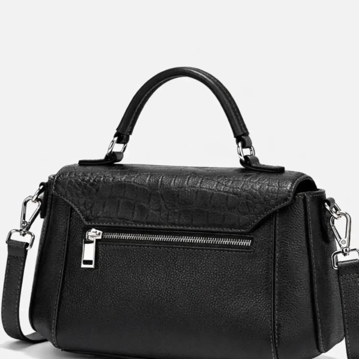 back view of black leather satchel showing adjustable strap