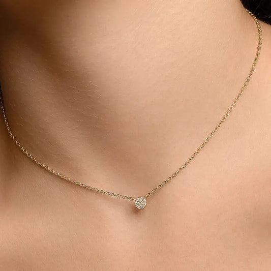 model wearing gold round CZ pendant minimalist outfit