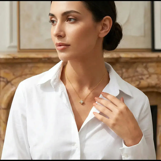 Lifestyle shot of a woman featuring the gold moissanite clover necklace for a refined look.