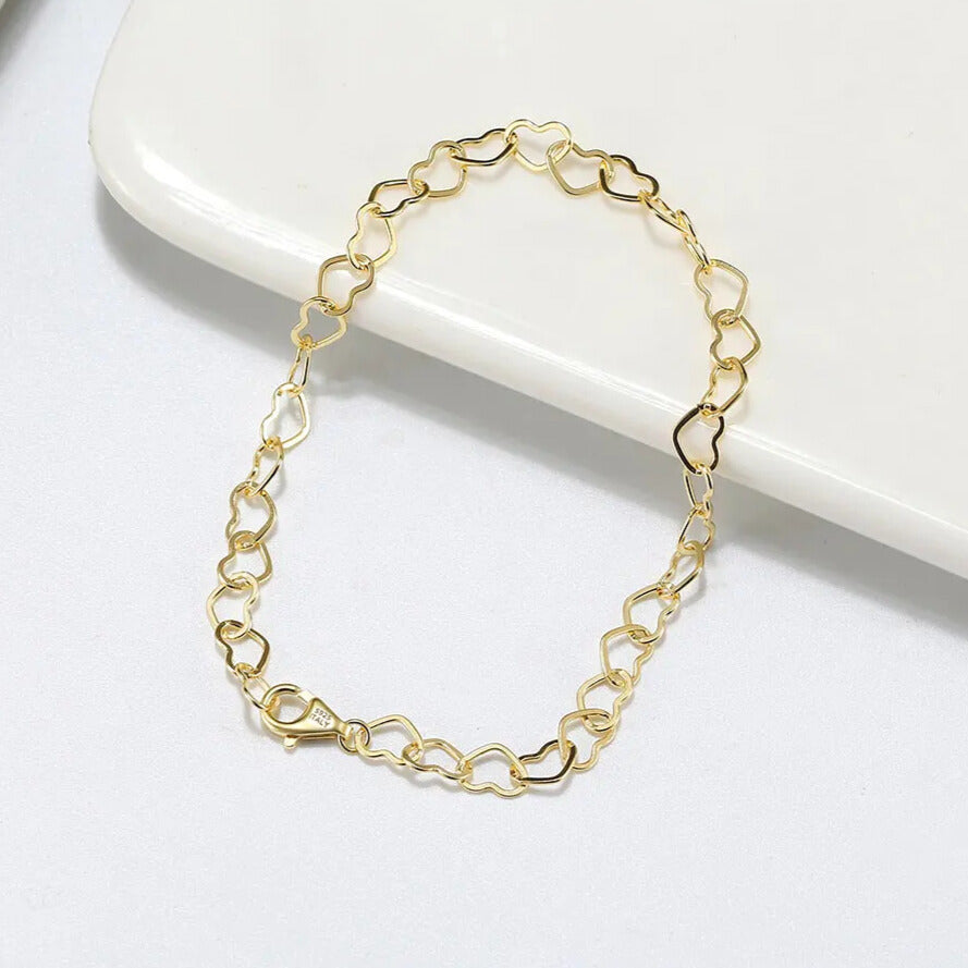 delicate heart chain bracelet polished gold plated finish