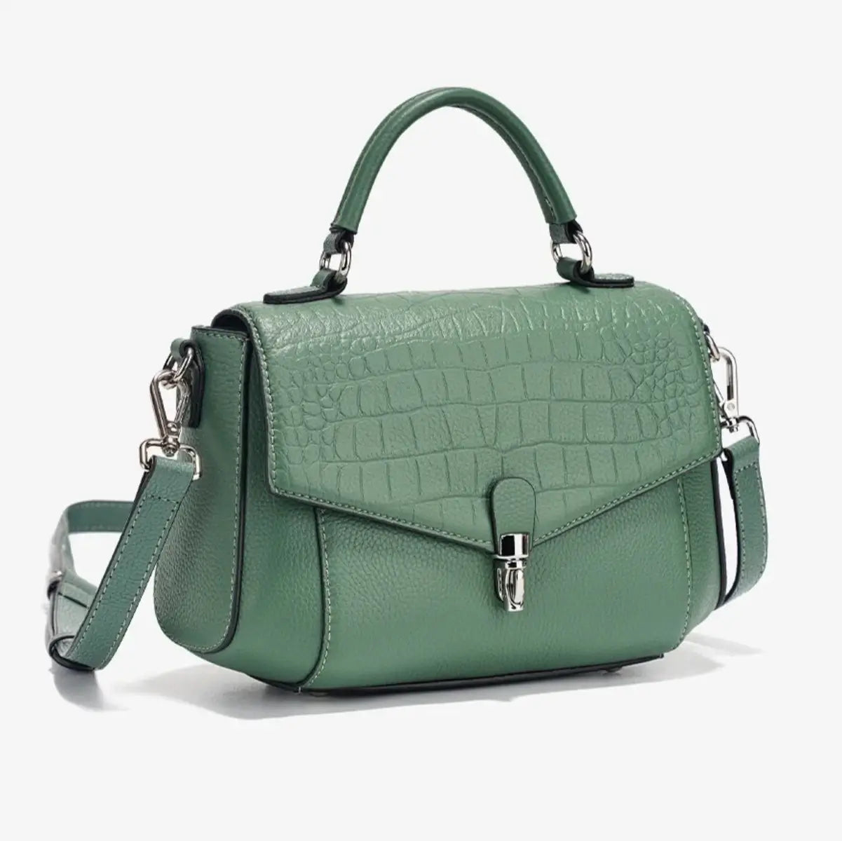 Close-up detail of green crocodile-embossed leather texture.