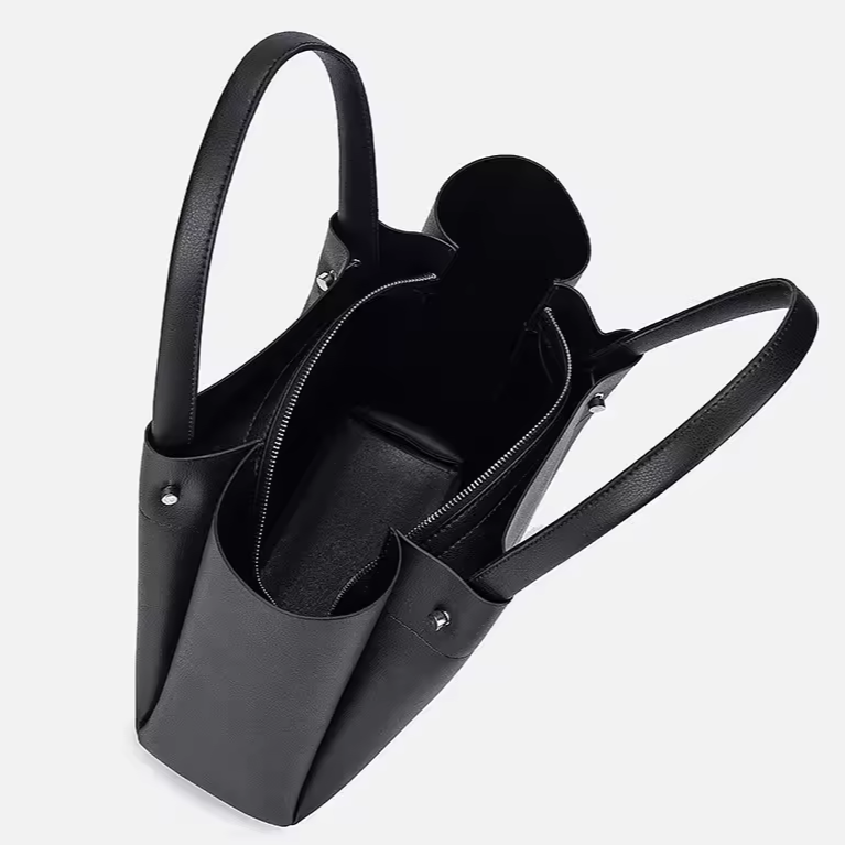Spacious black tote backpack displayed open showing interior space