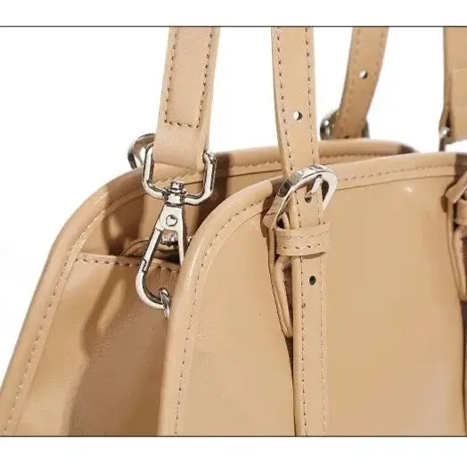 beige leather crossbody bag with adjustable strap