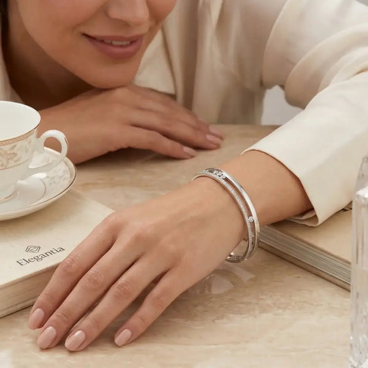 925 Sterling silver bangle bracelet featuring a unique slider design with brilliant cubic zirconia stones.