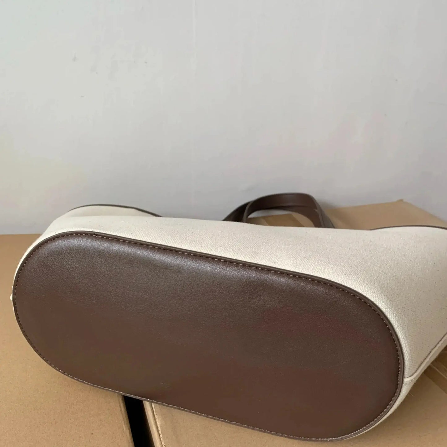 canvas tote bag with synthetic leather trim close-up