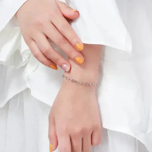 high-polish silver bracelet with delicate heart motifs