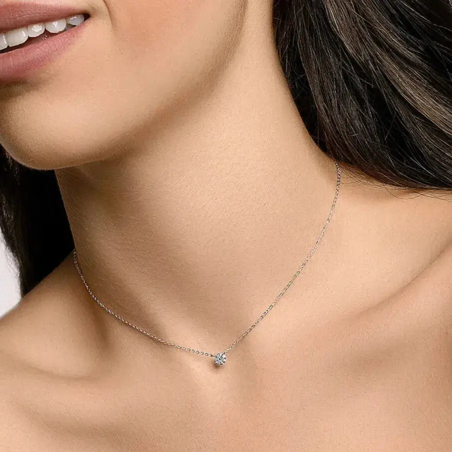Model wearing a minimalist 925 sterling silver necklace in a quiet luxury style, showcasing delicate shine for everyday elegance.