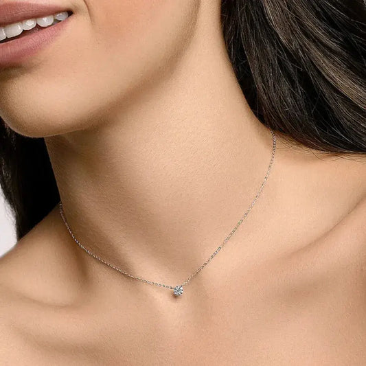 Model wearing a minimalist 925 sterling silver necklace in a quiet luxury style, showcasing delicate shine for everyday elegance.