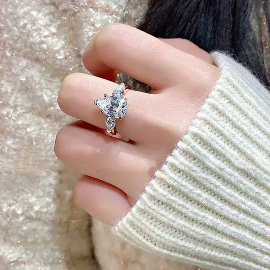 model wearing 925 sterling silver pear-cut moissanite ring
