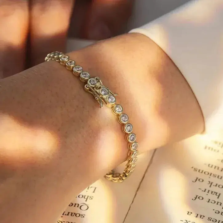 elegant gold tennis bracelet on wrist – refined feminine style