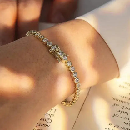 elegant gold tennis bracelet on wrist – refined feminine style