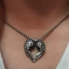 elegant silver heart necklace with angel wings design