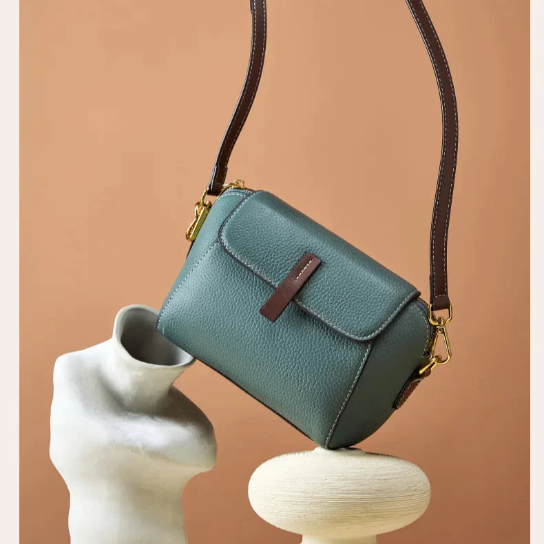 compact geometric silhouette blue bag