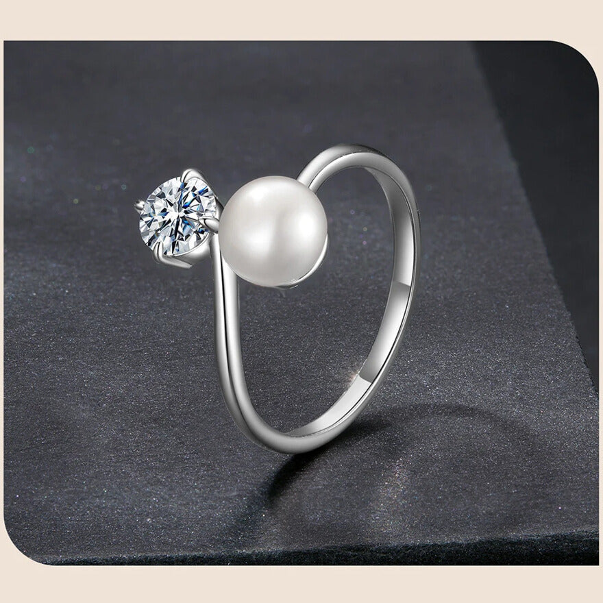 Side view of sterling-silver open ring with moissanite and pearl