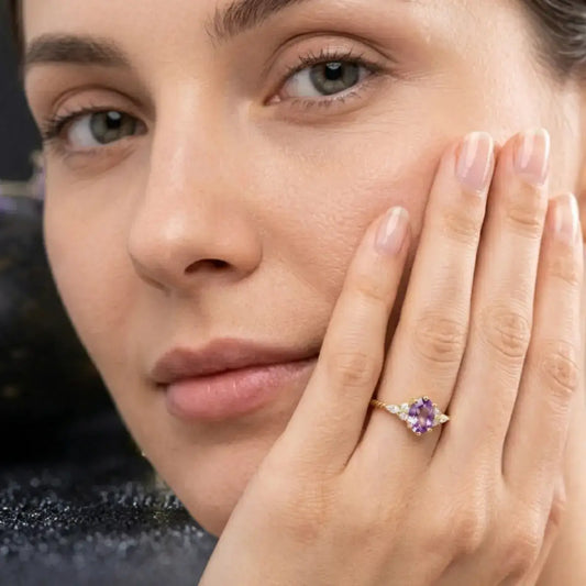 delicate amethyst ring gold plated with zircon worn on woman hand