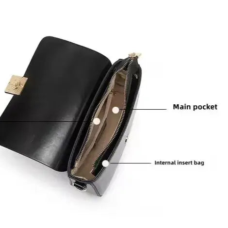 black leather crossbody bag shown open with organised interior