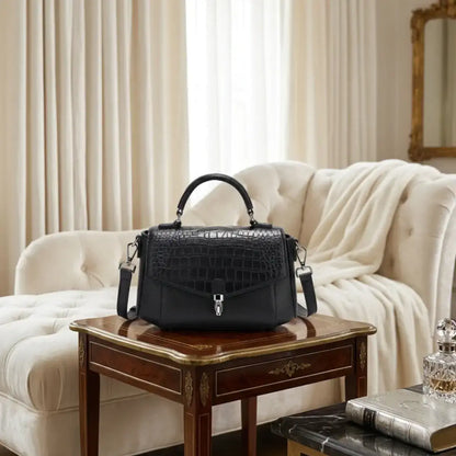 Classic black crocodile-embossed genuine leather satchel bag with silver hardware.