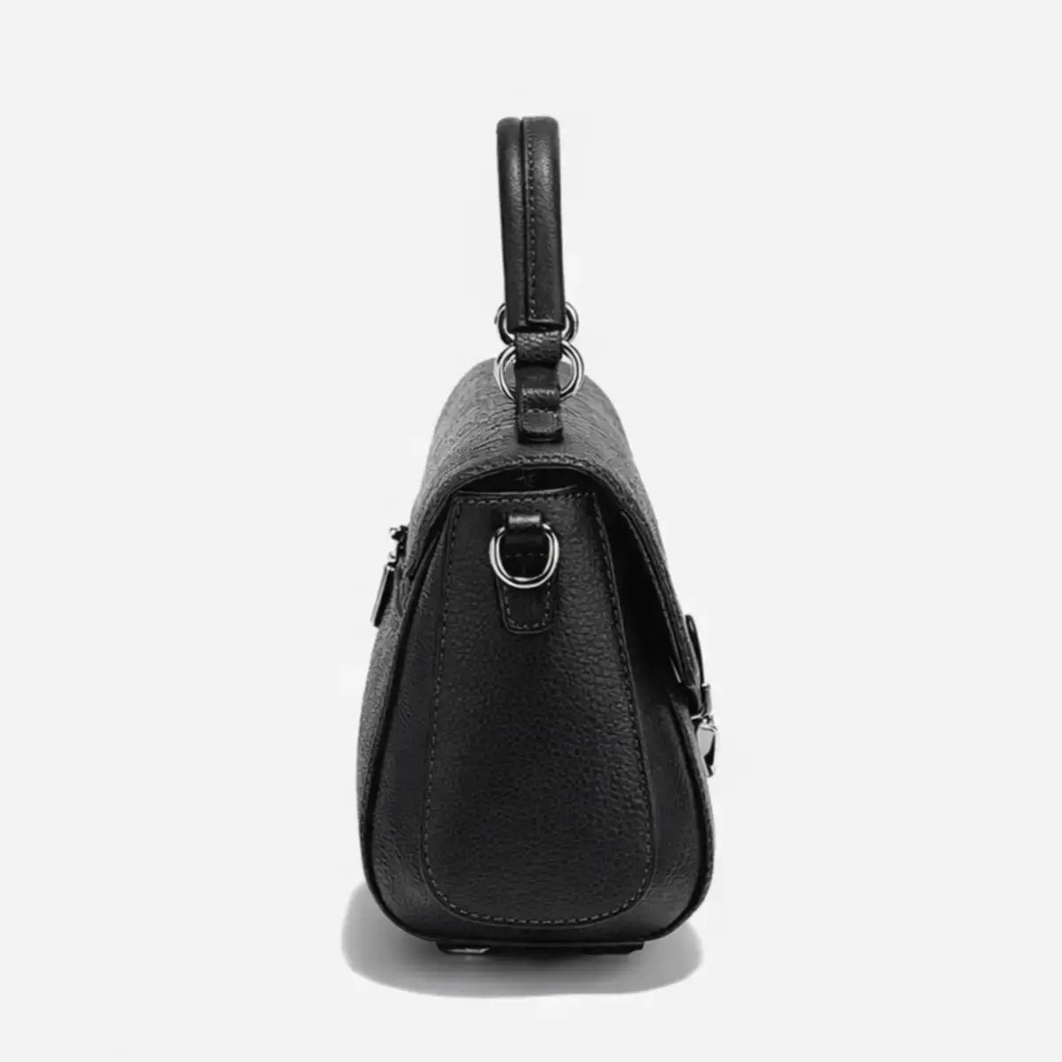 side view of black structured leather crossbody bag on model