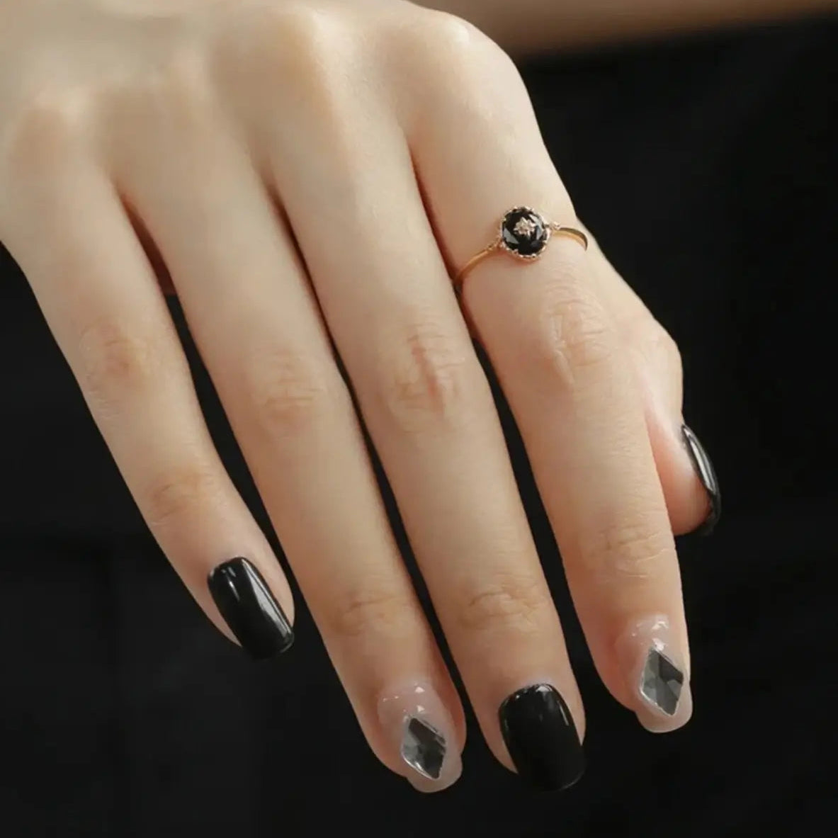 close-up of black agate oval ring in gold vermeil worn on finger