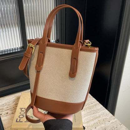 Brown canvas crossbody bucket bag