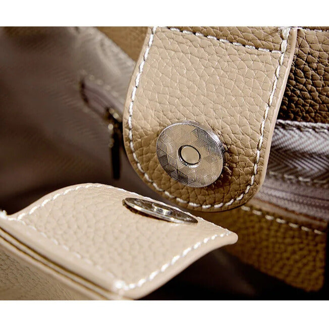 Minimalist designer leather bucket bag beige or brown for everyday and evening wear