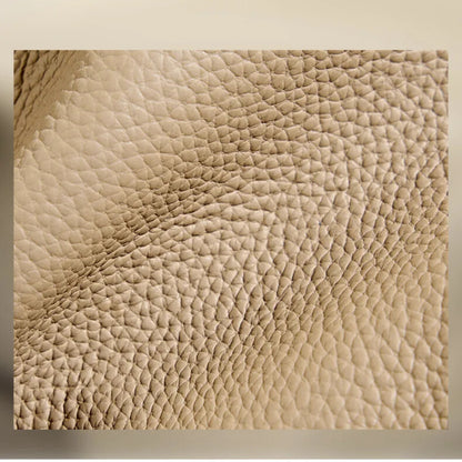 Detailed view of premium leather grain on luxury women’s bucket bag