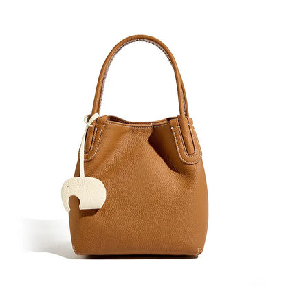 Luxury women’s leather bucket bag with shoulder and crossbody strap
