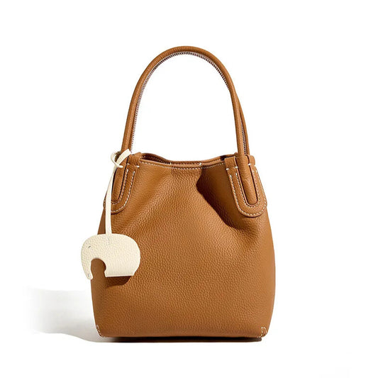 Luxury women’s leather bucket bag with shoulder and crossbody strap