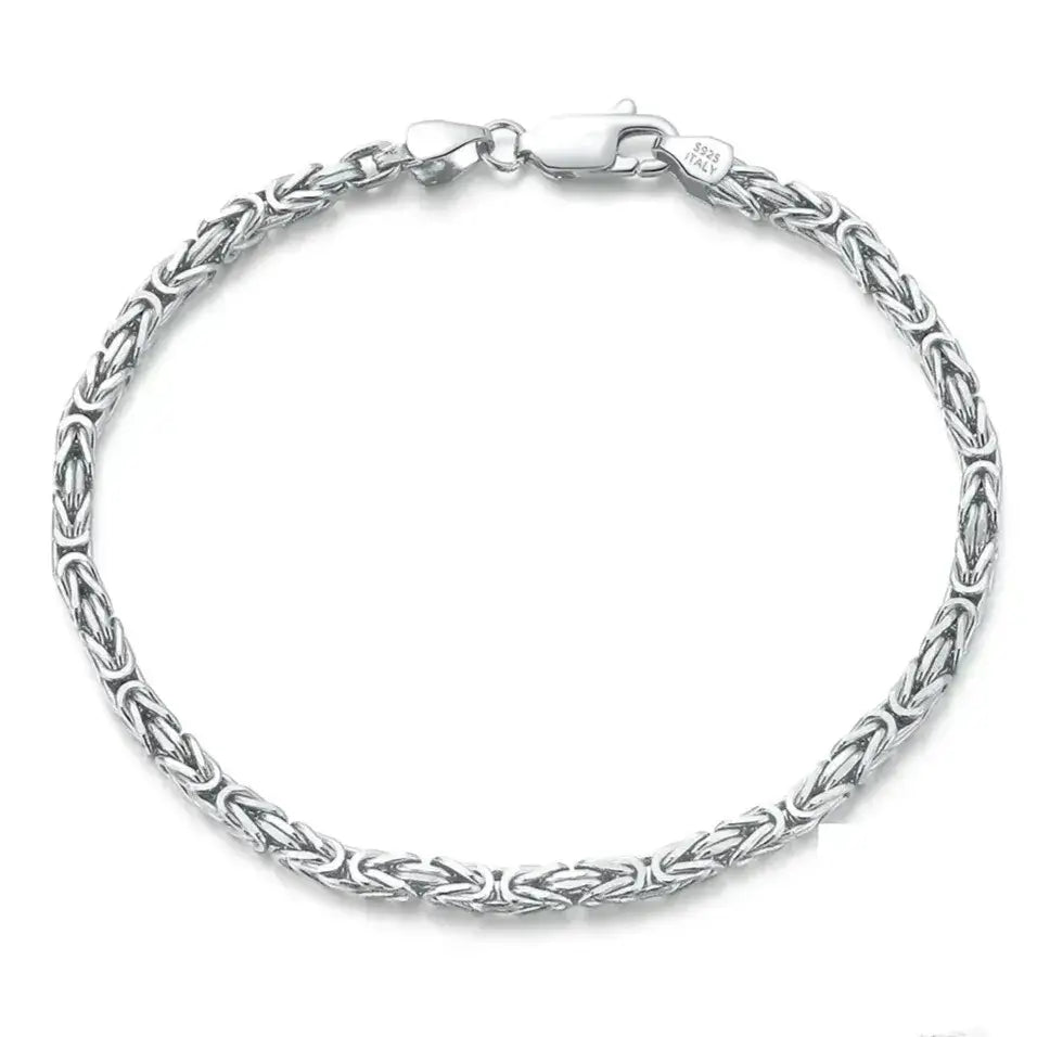 sterling silver byzantine chain bracelet with rounded links on a neutral background