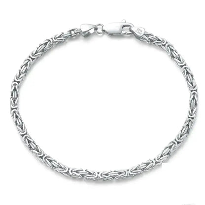 sterling silver byzantine chain bracelet with rounded links on a neutral background