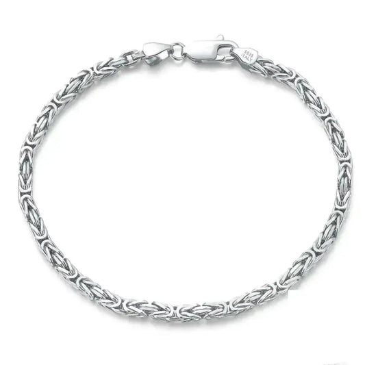 sterling silver byzantine chain bracelet with rounded links on a neutral background