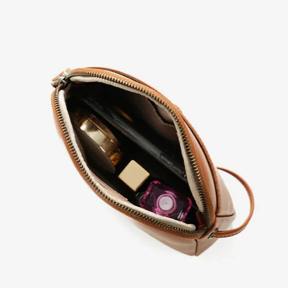 Charméa Mini — organised interior with phone slot and zip pocket