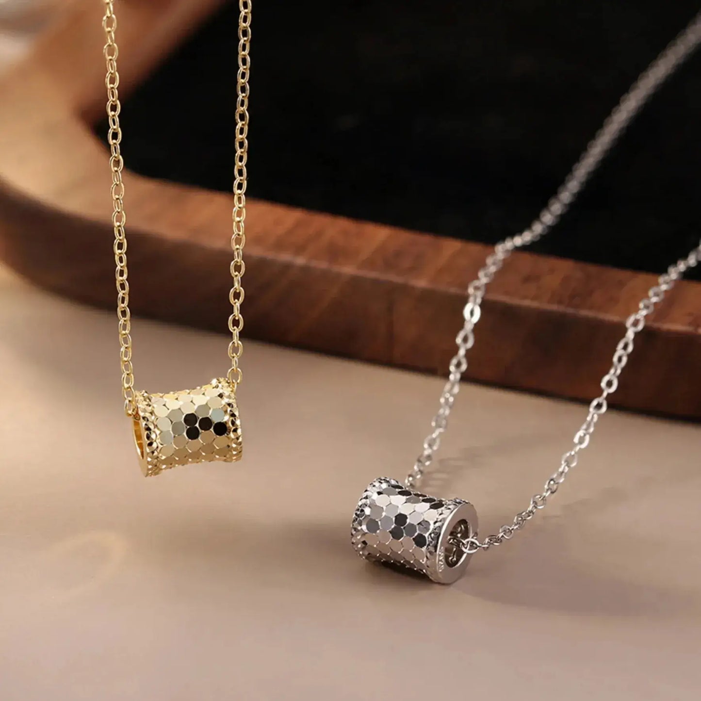 detailed view of pendant and clasp of gold or silver vintage necklace Elegantia