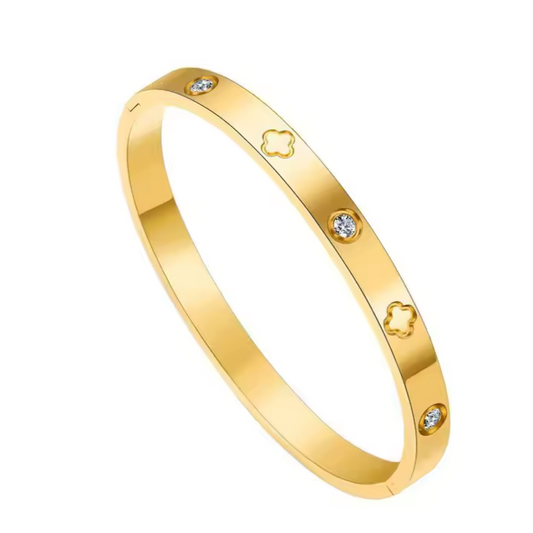 Gold clover zircon bangle in stainless steel on wrist