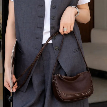 compact leather crossbody phone bag lifestyle view