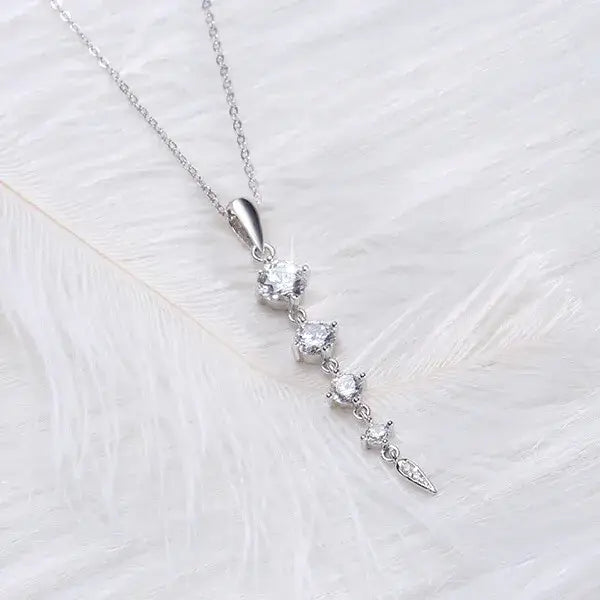 Close-up of sparkling AAA cubic zirconia crystals on a silver pendant