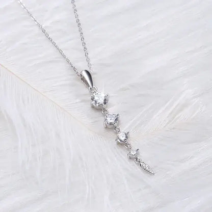 Close-up of sparkling AAA cubic zirconia crystals on a silver pendant