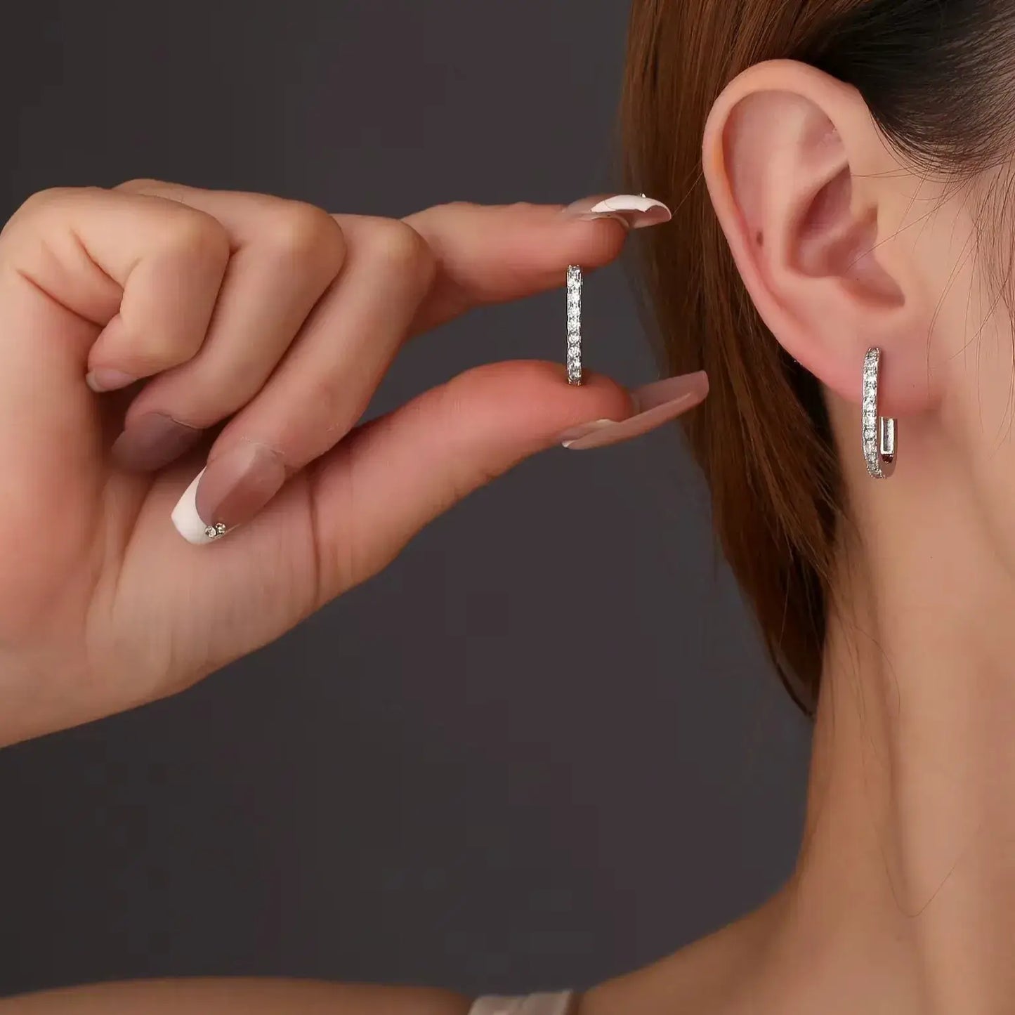 minimalist sterling silver hoop on ear