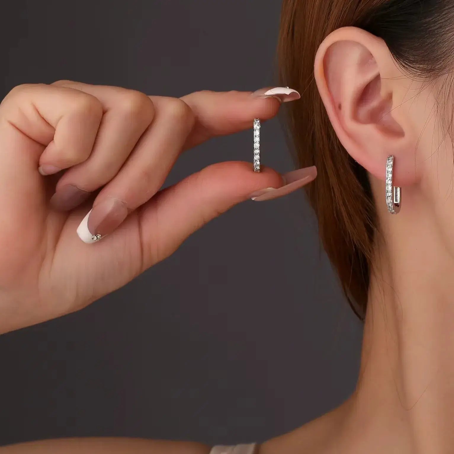 minimalist sterling silver hoop on ear