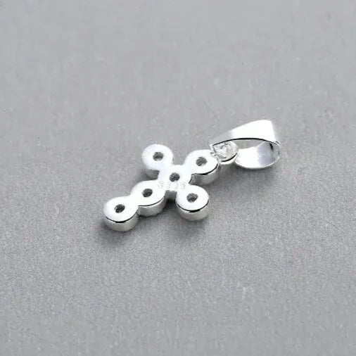 minimalist silver cross pendant with cubic zirconia back view
