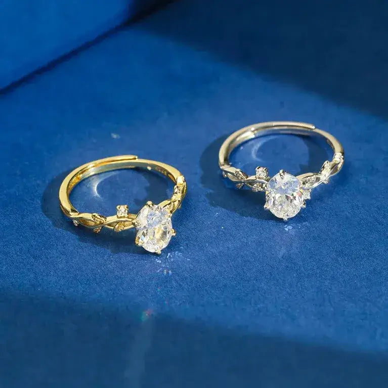 modern gold solitaire ring on neutral background