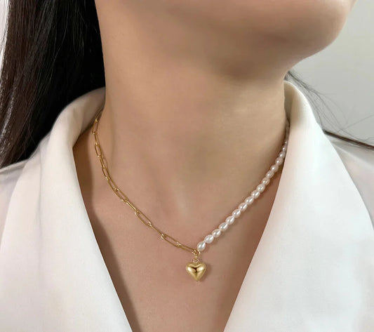 Close-up of freshwater pearl heart charm on paperclip link necklace