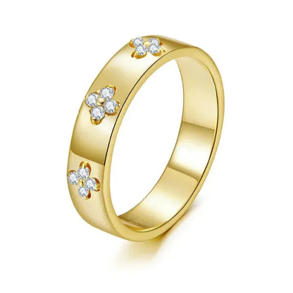 elegant gold clover ring on white background