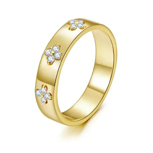 elegant gold clover ring on white background