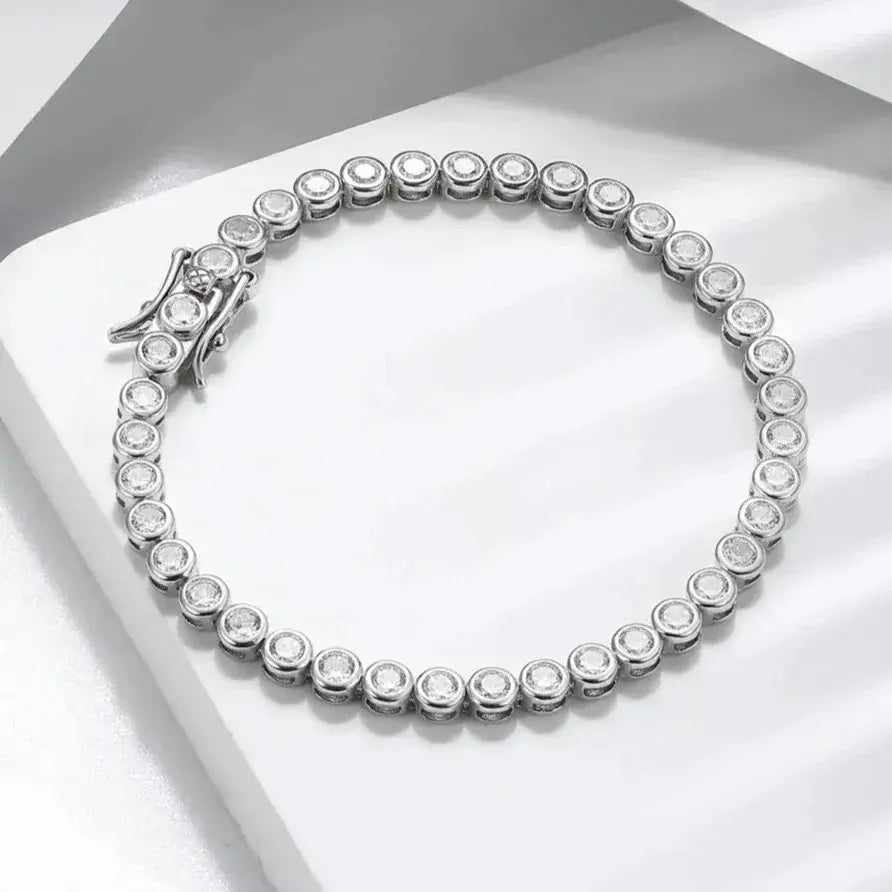 close-up of polished 3 mm AAAA cubic zirconia stones set in silver