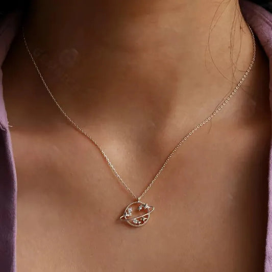 gold star and planet charm pendant with cubic zirconia sparkle