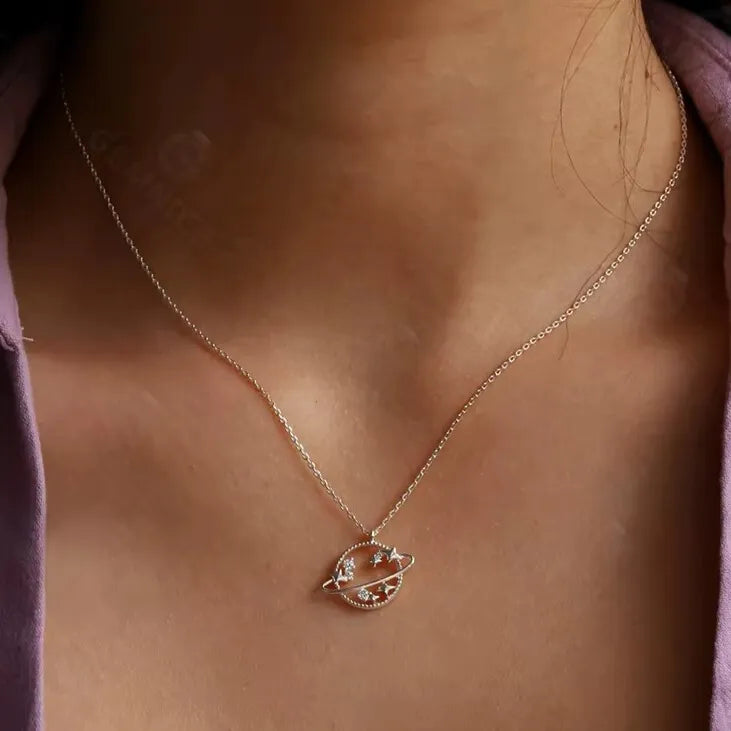 gold star and planet charm pendant with cubic zirconia sparkle