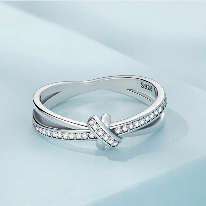 Stacking sterling silver knot ring with bezel CZ