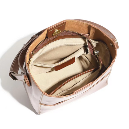 organised interior of alira beige leather crossbody showing spacious compartment