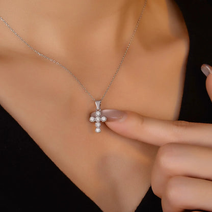 model wearing sterling silver cross pendant